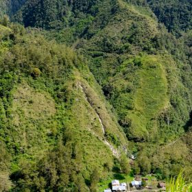 village an steep wall behind